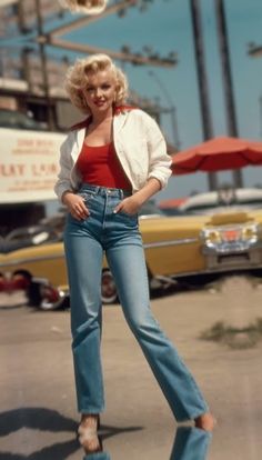 a woman standing on top of a parking lot