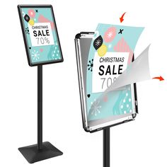 two signs with christmas sale tags on them