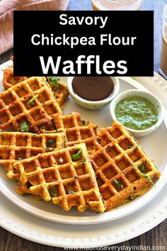 savory chickpea flour waffles on a plate with dipping sauce