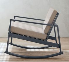 a rocking chair with a cushion on top of it