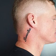 a man with a name tattoo on his neck