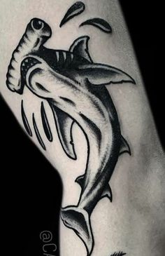 a black and white photo of a shark tattoo