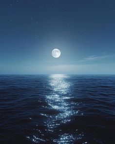 the moon is shining over the water at night with stars in the sky above it