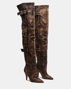 Expertly crafted, the BADDIE boot is both edgy and practical. Made with a pointed toe and buckle detail, these over-the-knee heeled boots offer a unique touch to any outfit. Elevate your style with these statement boots. 3.5 inch heel height Size 6 measurements: 16.5 inch shaft circumference, 22 inch shaft height Size 8 measurements: 17.25 inch shaft circumference, 22.5 inch shaft height Size 10 measurements: 18 inch shaft circumference, 23 inch shaft height Leather upper material Vegan leather 90s Boots, Statement Boots, Resale Clothing, Open Toe Boots, Steve Madden Boots, Dress Loafers, Fashion Collage, Leather Socks, 5 Inch Heels