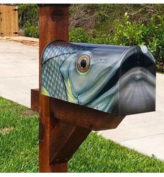 a mailbox with a fish painted on it