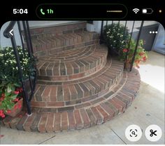 an image of a set of stairs with flowers