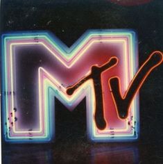 the letter m is made up of neon colored lights and letters that spell out tv