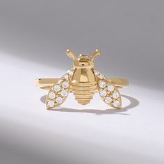 The 14k Solid Gold Bee Ring is a captivating statement piece, crafted to embody the beauty of nature. Featuring a detailed bee design adorned with pavé diamonds, this unique insect ring exudes elegance and charm. Perfect for those who love nature-inspired jewelry, this high-quality handmade gold ring is a striking addition to any collection. A timeless piece, it's ideal for women who appreciate intricate craftsmanship and bold, luxurious accessories. 𝐈𝐭𝐞𝐦 𝐃𝐞𝐭𝐚𝐢𝐥𝐬 * Gold KT: 10K, 14K, Bug Ring, Insect Ring, Bday Presents, Handmade Gold Ring, Bee Ring, Gold Bee, Nature Inspired Jewelry, Bee Design, Handmade Gold