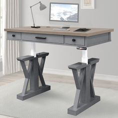 a computer desk with two legs and a monitor on top