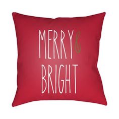 a red pillow with merry and bright written on the front, along with white lettering