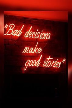 a red neon sign that says bad decisions make good stories