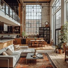 a living room filled with furniture and lots of windows