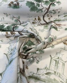 an image of a bed sheet with trees and buildings in the backgroung