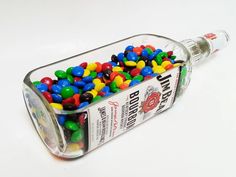 a bottle filled with lots of colorful candy