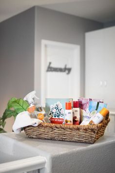 a wicker basket filled with personal care items on top of a counter in a bathroom