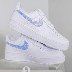 Sneakers by Nike. Designs by DJ ZO Designs Iridescent blue rhinestones on swooshes are hand-glued one-by-one The beauty of iridescence is that the crystals can look a little different in different lighting! SIZE & FIT Nike Air Force 1 fit true to size Nike Women's Shoe Size Chart Nike Rosa, Quinceanera Shoes, Nike Kids Shoes, Casual Shoes Women Sneakers, Nike Shoes Women Fashion, Pretty Sneakers, Shoe Size Chart Kids, Pretty Shoes Sneakers, Sparkle Shoes