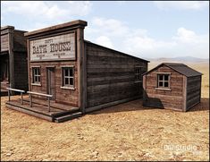 an old wooden building sitting on top of a dry grass covered field next to two small buildings