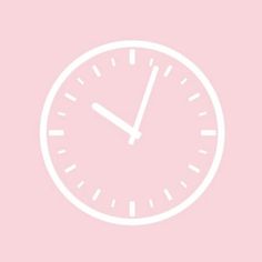 a white clock on a pink background