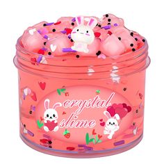 a pink plastic container filled with lots of confetti