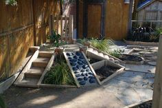 an outdoor garden area with steps and plants