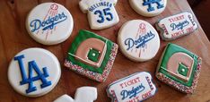 decorated cookies are arranged on a wooden table