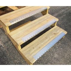 two wooden benches sitting next to each other