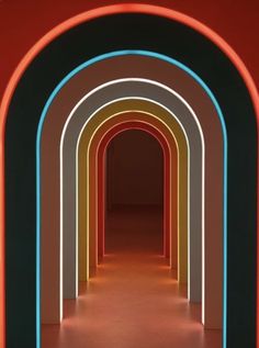 an image of a tunnel with neon lights on the walls and floor in the middle