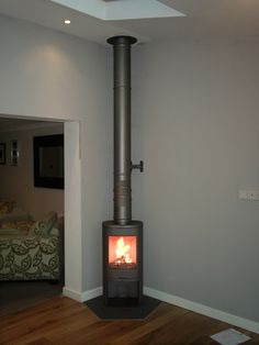 a wood burning stove in the corner of a room