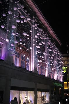 a building with lights all over it at night