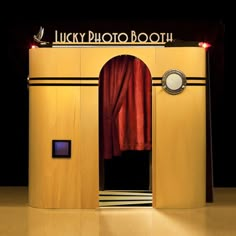 an entrance to a theater with red curtains