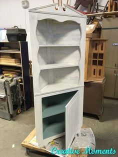 an old cabinet is being worked on in a shop