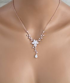 "Dainty Rose gold Bridal backdrop necklace and earrings set. Created in a lovely vine floral design that sparkles with Swarovski Pure Brilliance stones - Necklace measures 16 inches and extends to 18 inches - Backdrop measures 9 inches - You can choose a removable backdrop option in the drop down menu. This gives you an option to be able to wear the necklace alone without the backdrop. - Earrings dangle 1-3/8\" - Rose gold finish - Swarovski Pure Brilliance stones - Nickel free - Available in ro Bridal Backdrop Necklace, Backdrop Necklace, Rose Gold Bridal Earrings, Gold Bridal Necklace, Backdrops Necklace, Bridal Earrings Drop, Gold Bridal Earrings, Necklace Rose Gold, Rose Gold Bridal