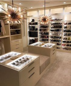 a large walk in closet filled with lots of shoes