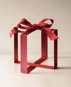 a red box with a ribbon tied around it