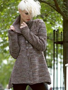 a woman with blonde hair is standing outside