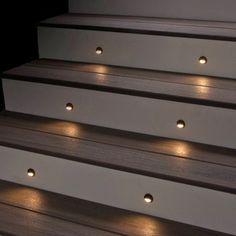 some white steps with lights on them