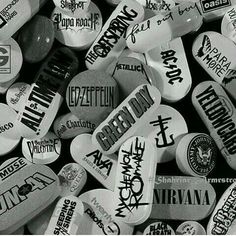 black and white photograph of many different types of rock'n'roll guitar picks