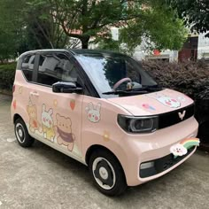 a pink car with cartoon characters painted on it