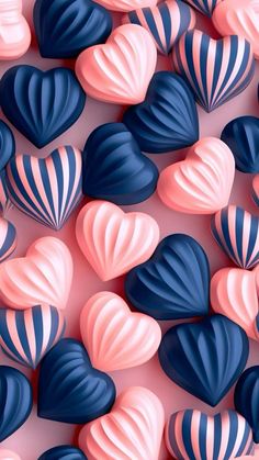 many hearts are arranged on a pink and blue background