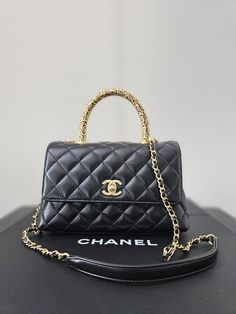 Beautiful, Rare Chanel Coco Handle Bag in Excellent/Like-New Pre-owned Condition! • Chanel Top Handle Bag • From the Fall 2022 Collection • Black Quilted Leather • Interlocking CC Logo • Gold-Tone Hardware • Rolled Handle & Detachable Chain-Link Shoulder Strap • Single Exterior Pocket • Leather Red Lining • Turn-Lock & Flap Closures at Front • Folded original box, original dust bag, 2 camellias and chanel ties included) Affordable Chanel Bag, Chanel Top Handle Bag, Chanel Top Handle, Chanel Coco Handle, Chanel Top, Coco Handle, Chanel Purse, Fall 2022, Black Quilt