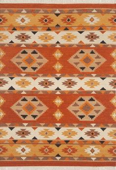 an orange and brown rug with different patterns