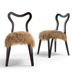 two chairs with furry seats on them, one in black and the other in brown