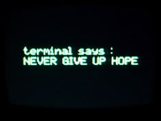 the words terminal says never give up hope are projected on an old tv screen at night