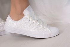 "Our current production time is 1-5 weeks.If you need the shoes faster than that you can add our rush order to your cart : https://www.etsy.com/listing/673922760/ Made with love for your wedding day by Lovin Bridal - More Wedding shoes at our shop : http://lovincollection.etsy.com It's the bride's prerogative to wear the comfiest wedding shoes. If you're set on heels then one option is to have your Lace Bridal Converse tennis shoes as a second pair of wedding shoes to change into for the recepti White Lace-up Wedding Shoes With White Laces, White Lace-up Wedding Shoes, White Lace-up Wedding Shoes For Bridal Shower, Low-top Wedding Shoes With White Laces, Elegant White Low-top Wedding Shoes, Elegant White Sneakers For Bridal Shower, Lace Converse, Wedding Sneakers For Bride, Bride Converse