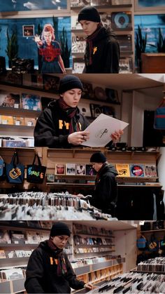 two men are looking at items in a store, one is holding a piece of paper