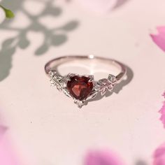 Cue the romance with our stunning Heart’s Desire Red Garnet Ring. This perfect expression of true love features a heart-shaped red garnet center stone along with a curved white topaz leafy band that adds a natural charm. A cherished keepsake that radiates love from every angle. Made in 14K white gold vermeil (14K white gold plated over a sterling silver base). To extend the life of your gold vermeil jewelry, avoid wearing it when washing hands, showering, swimming, applying hand sanitizer/lotion Red Promise Rings For Her, Red Ring Aesthetic, Gothic Promise Rings, Promise Ring Aesthetic, Pretty Promise Rings, Heart Rings Engagement, Couple Rings Design Unique, Dainty Promise Rings