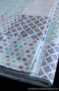 a close up view of the fabric on a quilted table runner with circles and dots