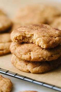 a stack of cookies sitting on top of a cooling rack