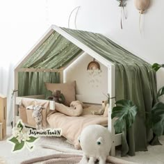 a child's bedroom with a tent bed and stuffed animals