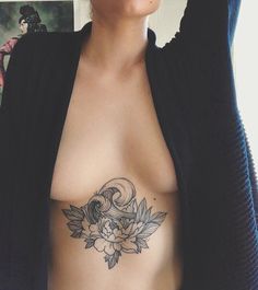 a woman with a tattoo on her chest